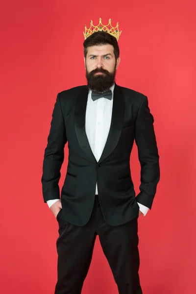 Royalty in his blood. Formal wear male fashion. Egoist. Businessman in tailored tuxedo and crown. Big boss. Formal event. King crown. Man groom in wedding suit. Bearded man in tuxedo and bow tie — Stock Photo, Image