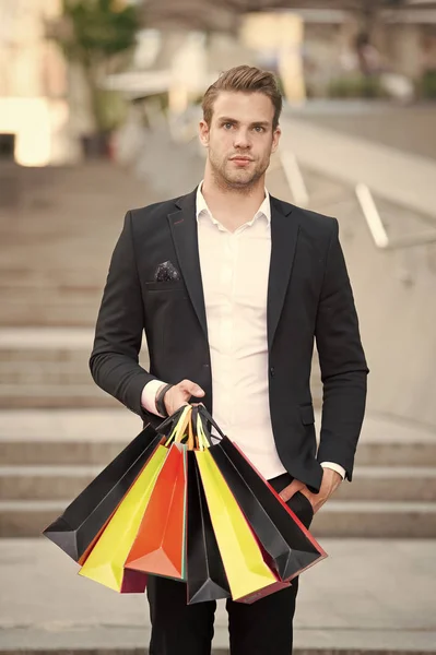 Shop alone. People find shopping partners more akin accomplices in crime. Man carry shopping bag. Guy shopped alone bought exactly what he needs. Alone shopping benefits — Stock Photo, Image