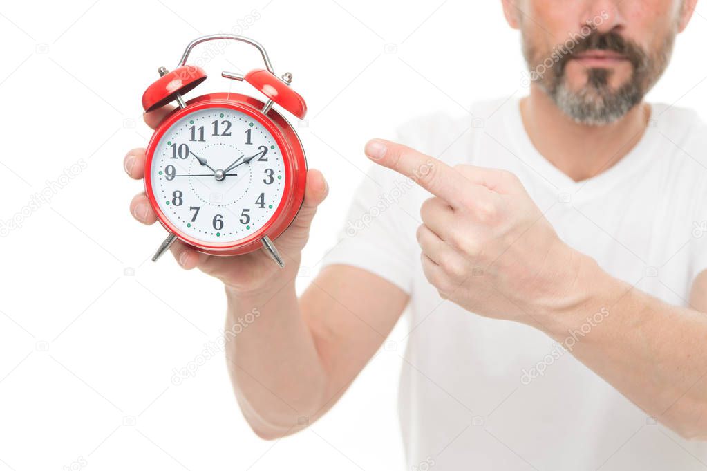 Check time. Man hold alarm clock in hand. Guy bearded mature man worry about time. What time is it. Time management and discipline. Punctuality and responsibility. Man with clock on white background