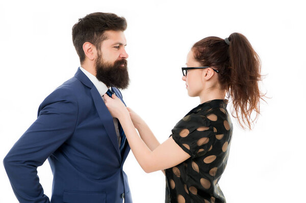 woman fix her man bowtie. formal business couple. business with personal assistant. elegant sexy woman fixing her lovers bowtie. Preparation for party. corporate party in office. mr perfection