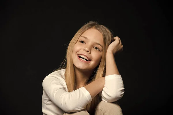 Dreamy mood. Girl long hair cute smiling dreamy face relaxing, black background. I wish all my dreams come true. Child happy carefree dreaming about future. Dreams come true — Stock Photo, Image