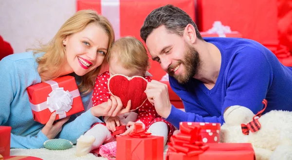 Couple in love and baby daughter. Valentines day concept. Together on valentines day. Lovely family celebrating valentines day. Happy parents. Family celebrate anniversary. Hearts filled with love