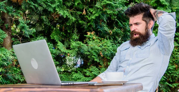 Find topic write. Bearded hipster laptop surfing internet. Reporter journalist daily routine. Working online. Online mass media worker. Write article for online magazine. Man looking for inspiration — Stock Photo, Image