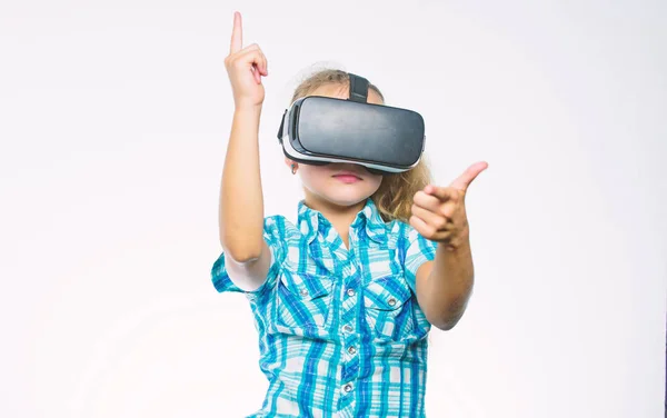 Girl cute child with head mounted display on white background. Get virtual experience. Virtual reality concept. Kid explore modern technology virtual reality. Virtual education for school pupil
