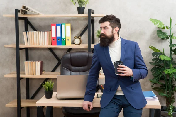 Relaxed top manager drinking coffee. Man bearded manager businessman entrepreneur hold cup of coffee. Boss enjoying energy drink. Worker start day with hot coffee. Benefits of office coffee culture