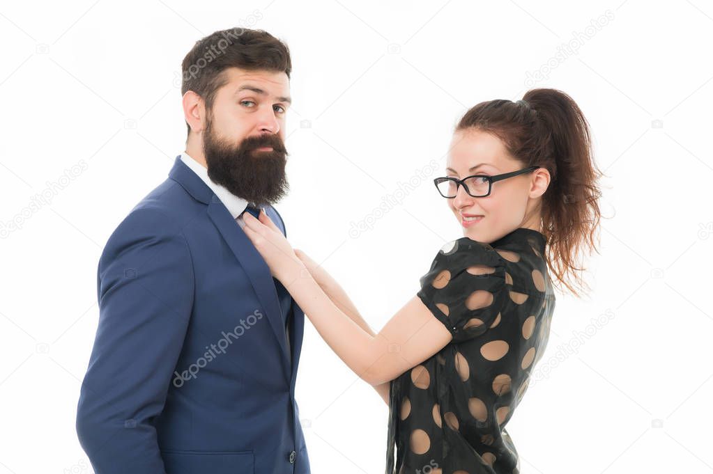 Help each other look perfect. Business partners man and woman adjust outfit before business conference or meeting. Boss and attractive lady assistant white background. Last detail. Business relations