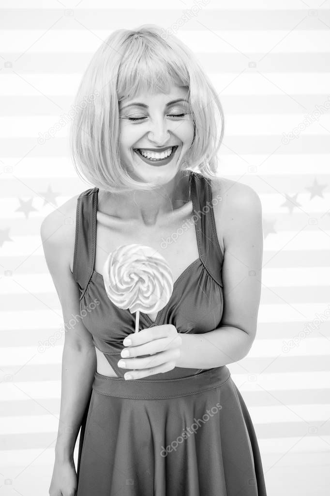 Crazy girl in playful mood. Cool girl with lollipop. Sexy woman. happy pinup model with lollipop. Fashion girl with orange hair having fun. Happiness and carelessness. Enjoy party. So much fun