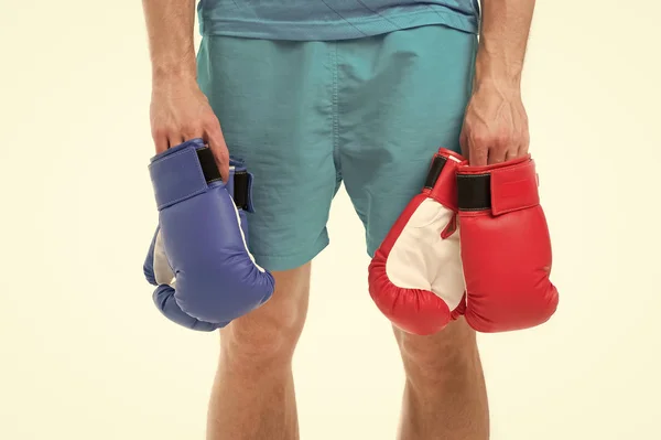boxing gloves in hand of man boxer. boxing gloves. sport fashion with red and blue boxing gloves. boxing concept with man boxer holding gloves. ready to fight.