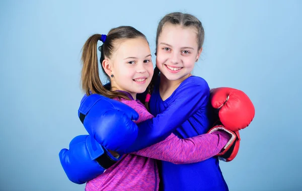 Happy children sportsman in boxing gloves. Sport success. Friendship. Fitness. energy health. workout of small girls boxer in sportswear. punching knockout. Childhood activity. I am ready to fight