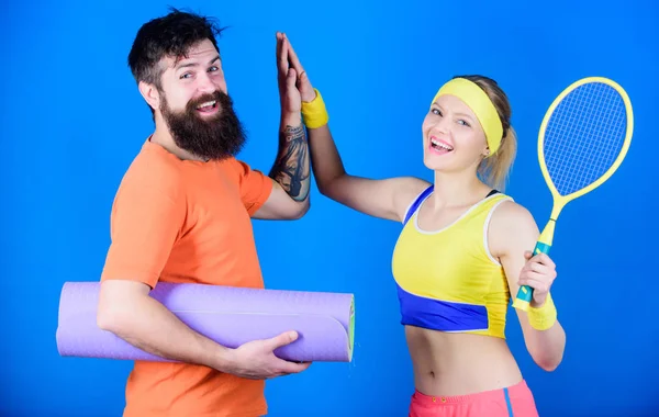 Fitness exercises. Workout and fitness. Girl and guy live healthy life. Fitness exercises. Sporty couple. Healthy lifestyle concept. Man and woman couple in love with yoga mat and sport equipment