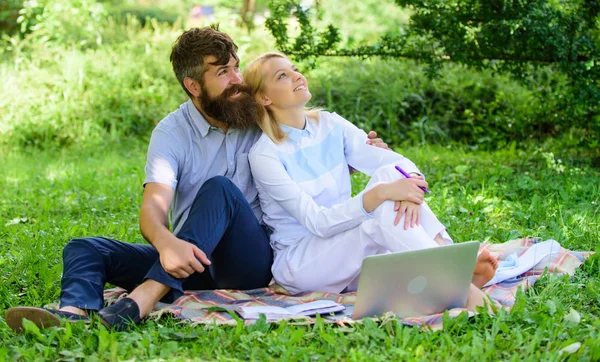 Couple in love or family work freelance. Modern online business. Freelance life benefit concept. Couple youth spend leisure outdoors working with laptop. How to balance freelance and family life