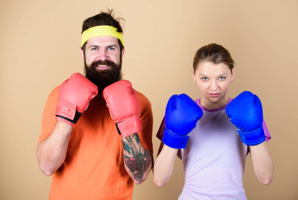 Ready to fight. Man and woman in boxing gloves. Boxing sport concept. Couple girl and hipster practicing boxing. Sport for everyone. Amateur boxing club. Equal possibilities. Strength and power