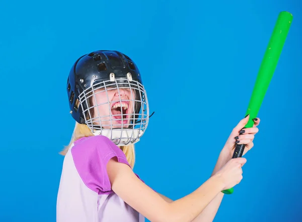 Woman in baseball sport. Girl confident pretty blonde wear baseball helmet and hold bat on blue background. Baseball female player concept. Ready repel attack. Woman enjoy play baseball game