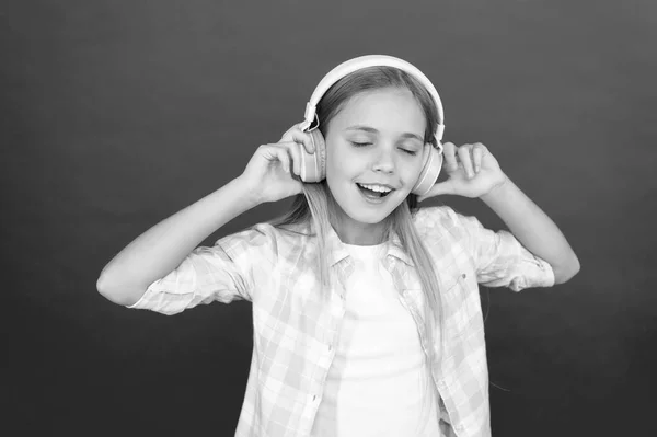 Girl child listen music modern headphones. Get music account subscription. Enjoy music concept. Music always with me. Leisure concept. Little girl listen song headphones. Online radio station channel
