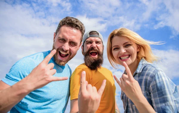 Vacation and hobby. Visit famous festival during vacation. Hard rock forever. Rock music festival. Heavy metal fans. Friends having fun summer open air festival. Men and girl enjoy music festival — Stock Photo, Image