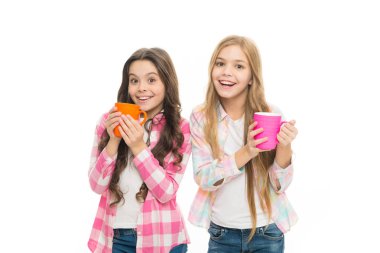Hot cocoa recipe. Children drink enough during school day. Make sure kids drink enough water. Girls kids hold cups white background. Sisters hold mugs. Drinking tea juice cocoa. Relaxing with drink clipart