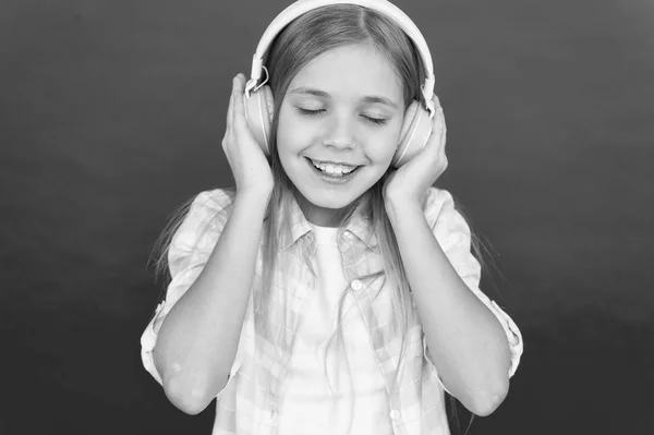 Girl child listen music modern headphones. Get music account subscription. Enjoy music concept. Music always with me. Little girl listen song headphones. Online radio station channel. Leisure concept — Stock Photo, Image