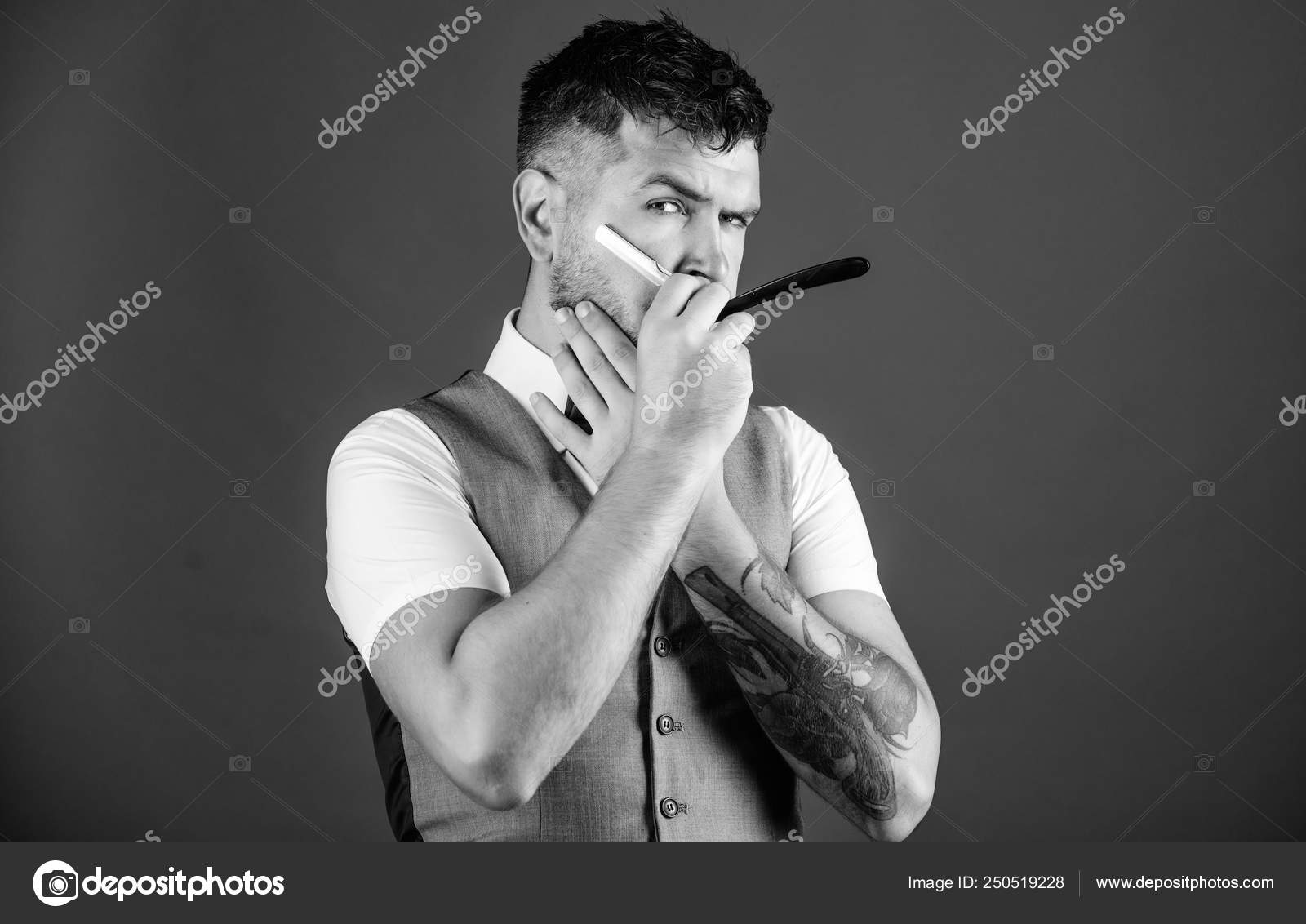 Barber art concept. Barber unshaven hipster with sharp danger straight