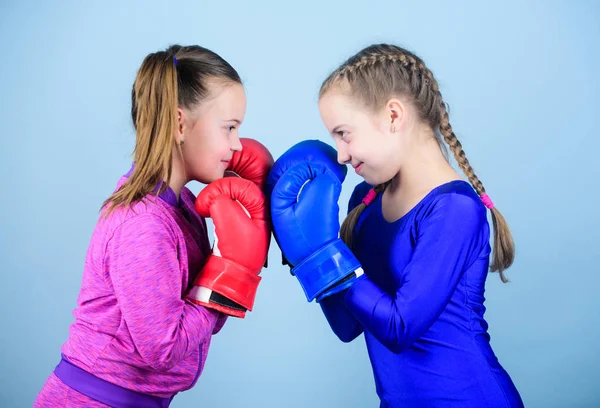 punching knockout. Childhood activity. Fitness diet. energy health. workout of small girls boxer in sportswear. Sport success. Friendship. Happy children sportsman in boxing gloves. Simply the best