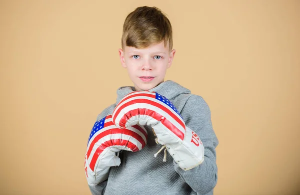 Sport. punching knockout. Childhood activity. Fitness diet. energy health. workout of small boy boxer. Sport success. sportswear fashion. usa independence day. Happy child sportsman in boxing gloves