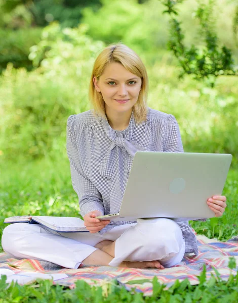 Business lady freelance work outdoors. Become successful freelancer. Woman with laptop sit on rug grass meadow. Online freelance career concept. Guide starting freelance career. Pleasant occupation