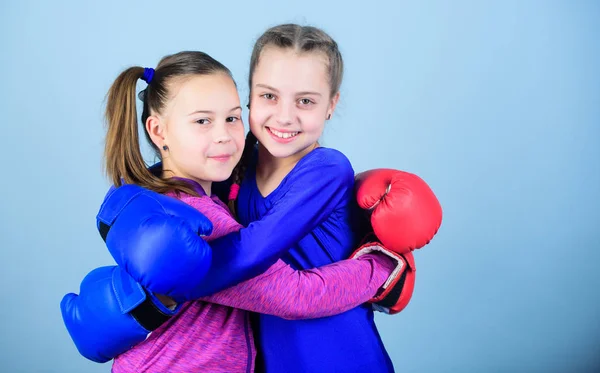 punching knockout. Childhood activity. workout of small girls boxer in sportswear. Sport success. Friendship. Fitness diet. energy health. Happy children sportsman in boxing gloves. we are the best