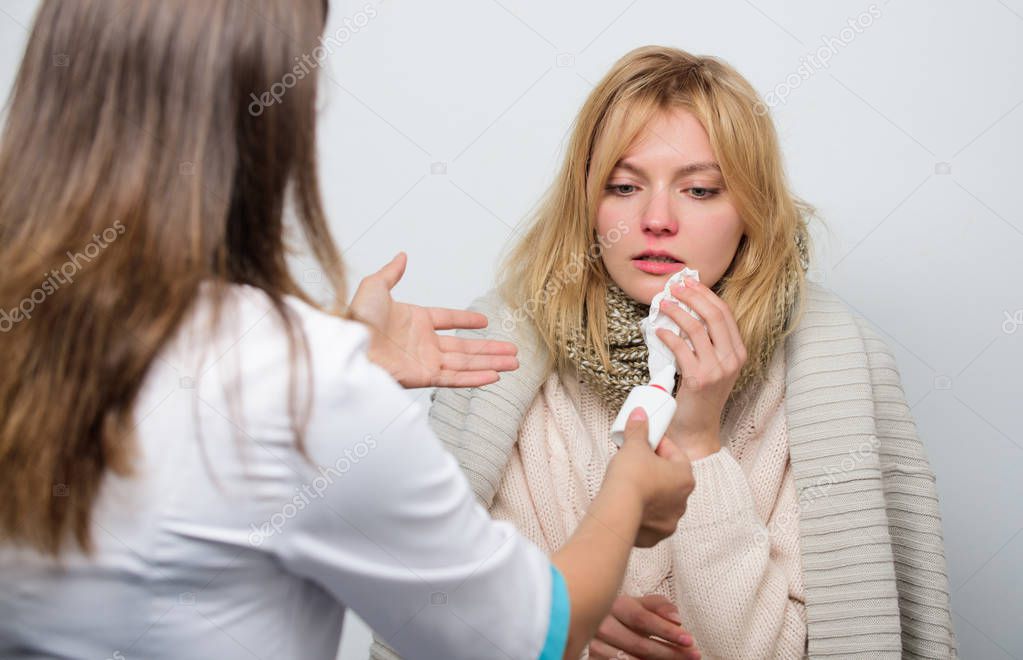 It will help her to breathe. Doctor visiting unhealthy woman at home. Medical doctor examining patient. Primary care doctor making diagnosis to sick woman. Patient care and healthcare