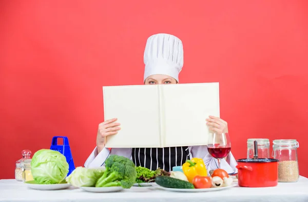 Professional level. Woman study culinary. Culinary expert. Chef cooking healthy food. Cooking techniques. Cook read book best culinary recipes. Culinary school concept. Book by famous chef copy space