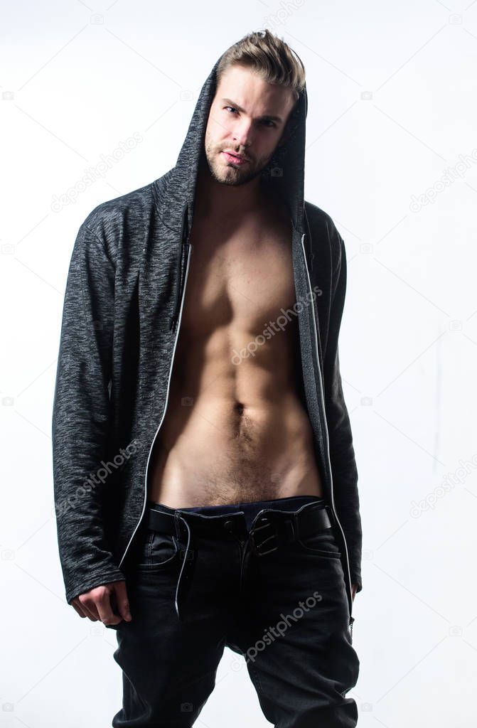 Man handsome sexy undressing. Hipster sexy muscular torso take off clothes. Seductive macho feeling sexy. Unleashed desire. Attractive sexy body. Confident in his attractiveness. Time change clothes