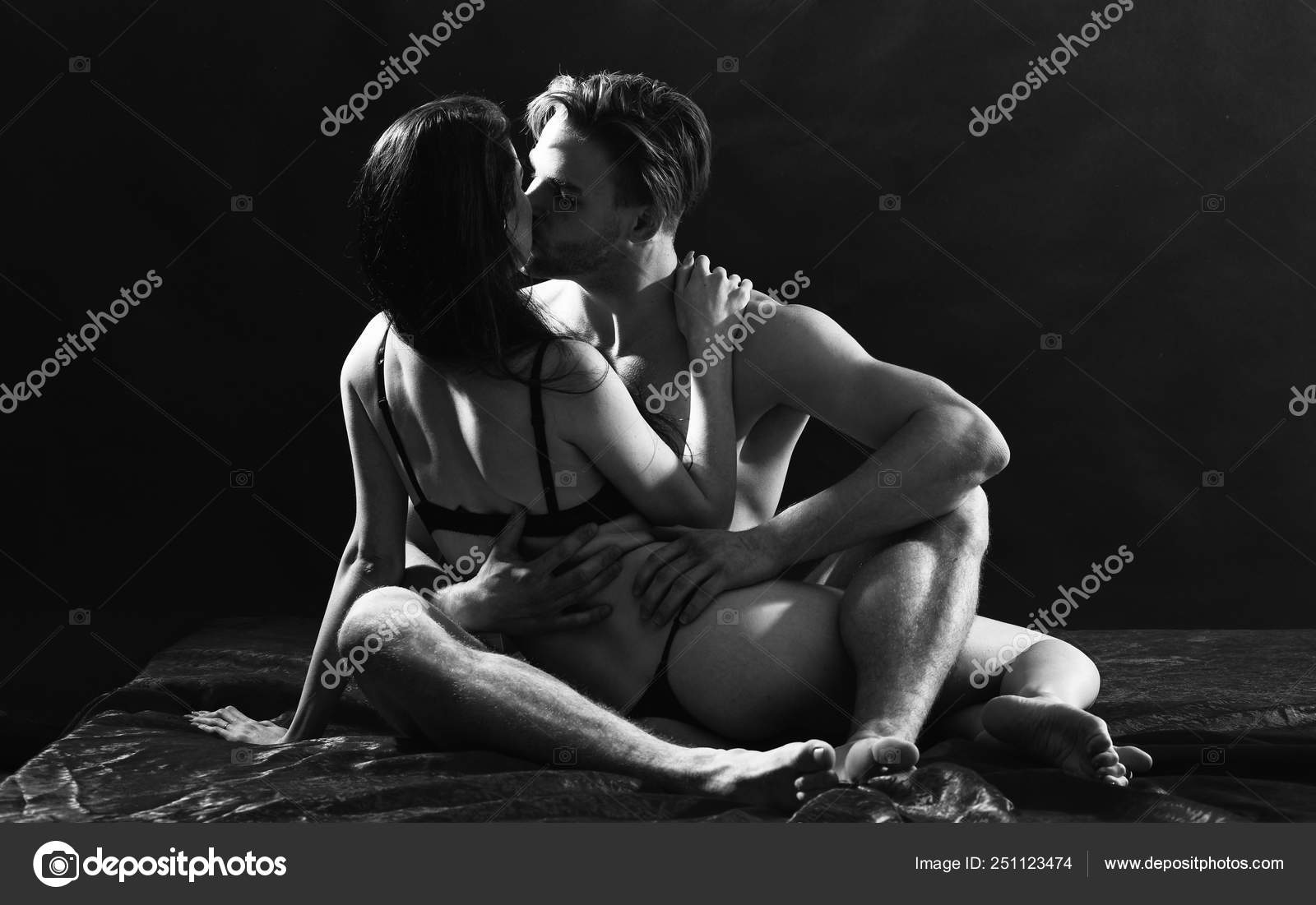 Man hug sexual girlfriend naked buttocks. Sex and love concept. Couple intimate atmosphere. Lover and sexy naked female body foreplay in