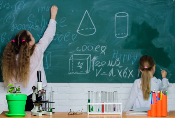 Doing science research with laboratory equipment. School children in science classroom. Lesson of natural science. Laboratory in elementary school. Science laboratory for school and education