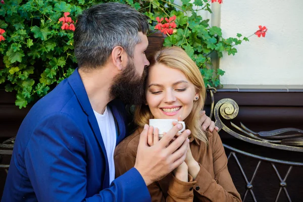 Couple cuddling cafe terrace. Couple in love sit cafe terrace enjoy coffee. Pleasant family weekend. Explore cafe and public places. Married lovely couple relaxing together. Travel and vacation — Stock Photo, Image