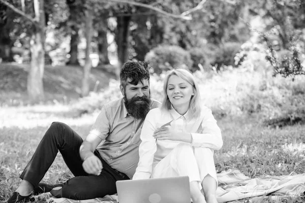 Couple in love or family work freelance. Freelance life benefit concept. Modern online business. Couple youth spend leisure outdoors working with laptop. How to balance freelance and family life