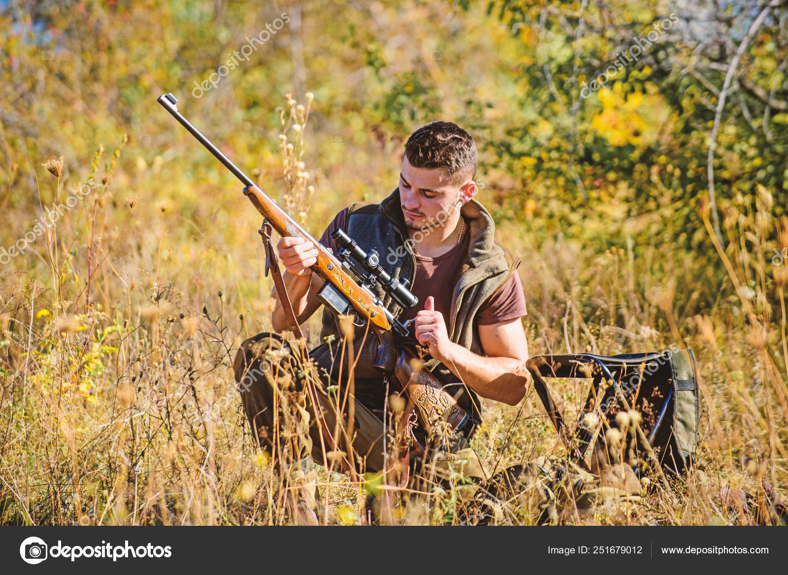 Hunting shooting trophy. Hunting hobby and leisure. Man charging hunting  rifle. Hunting equipment concept. Hunter with rifle looking for animal.  Hunter khaki clothes ready to hunt nature background Stock Photo by ©stetsik