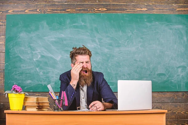 Educator bearded man yawning face tired at work. Educators more stressed at work than average people. Exhausting work in school causes fatigue. Life of teacher full of stress. High level fatigue