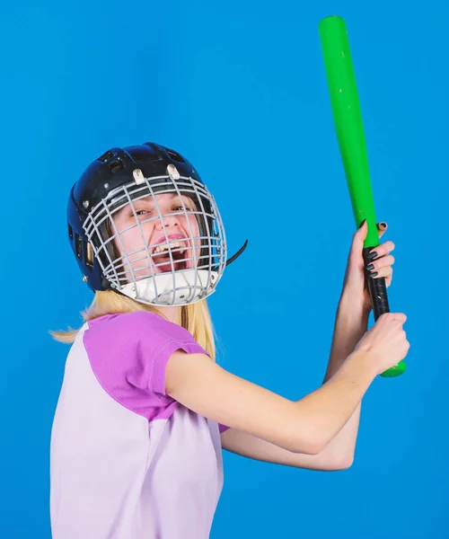 Baseball female player concept. Ready repel attack. Woman enjoy play baseball game. Woman in baseball sport. Girl confident pretty blonde wear baseball helmet and hold bat on blue background