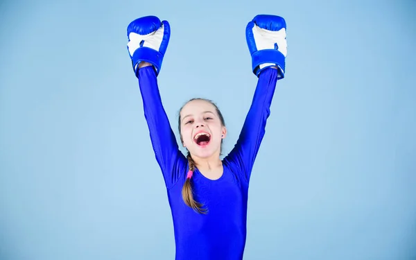 Full of energy. punching knockout. Childhood activity. Fitness diet. energy health. Sport success. sportswear fashion. Happy child sportsman in boxing gloves. workout of small girl boxer