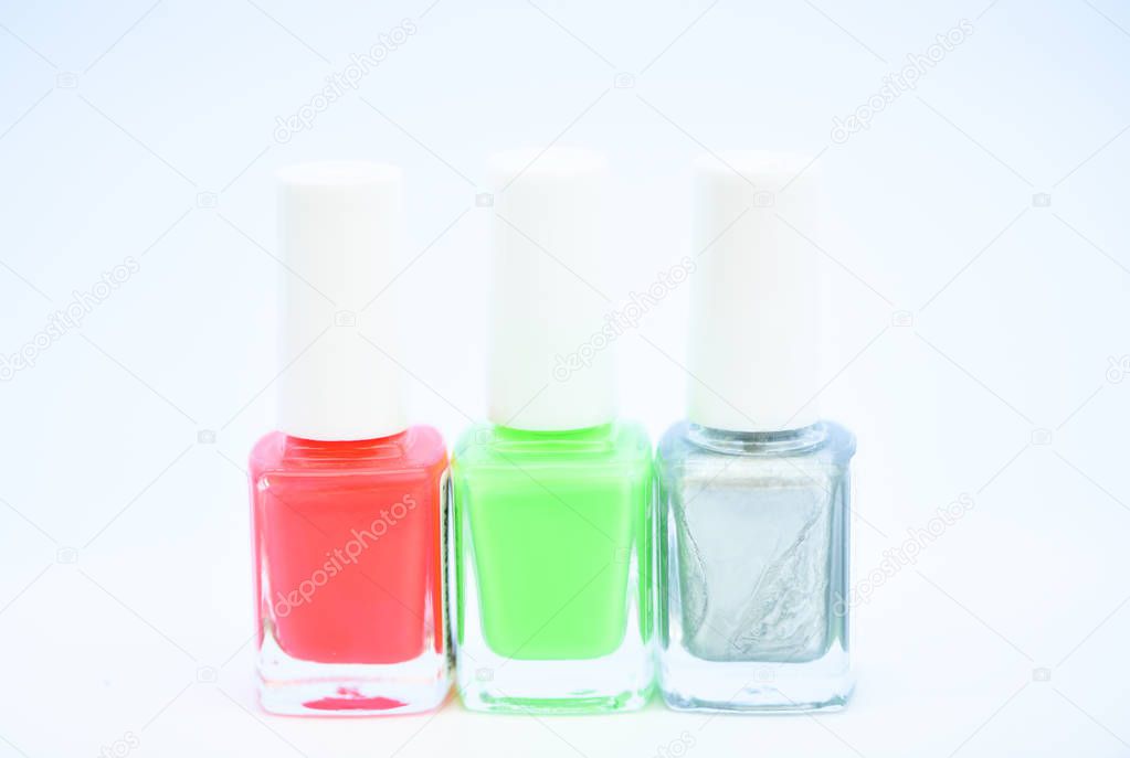 Beauty and care concept. Nail polish white background. Durability and quality polish coating. Gel polish modern technology. How to combine colors. Manicure salon. Fashion trend. Nail polish bottles