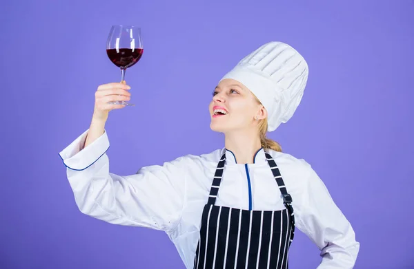 Which wine serve with dinner. Sommelier enjoy wine. Excellent taste. Sommelier skills. Serving wine at restaurant. Woman chef hold glass of wine. Outstanding toasts that work for any occasion