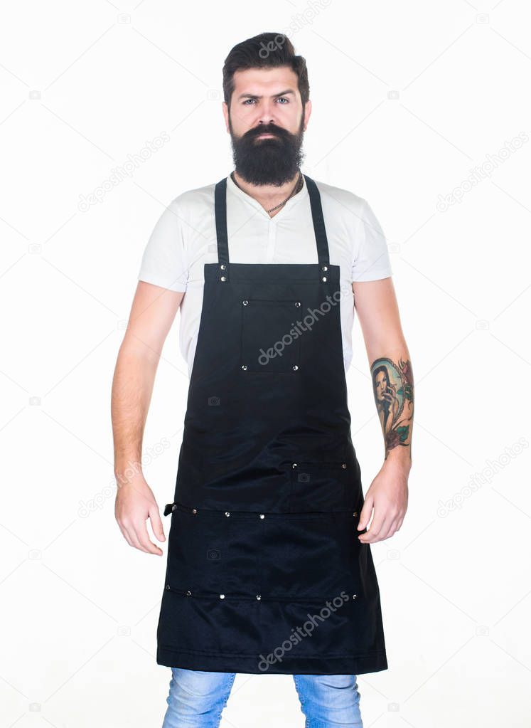 Staying clean and comfortable with chef apron. Bearded man cook in kitchen apron. Cook with long beard wearing bib apron. Master cook in cooking apron with pockets. Grill cook isolated on white