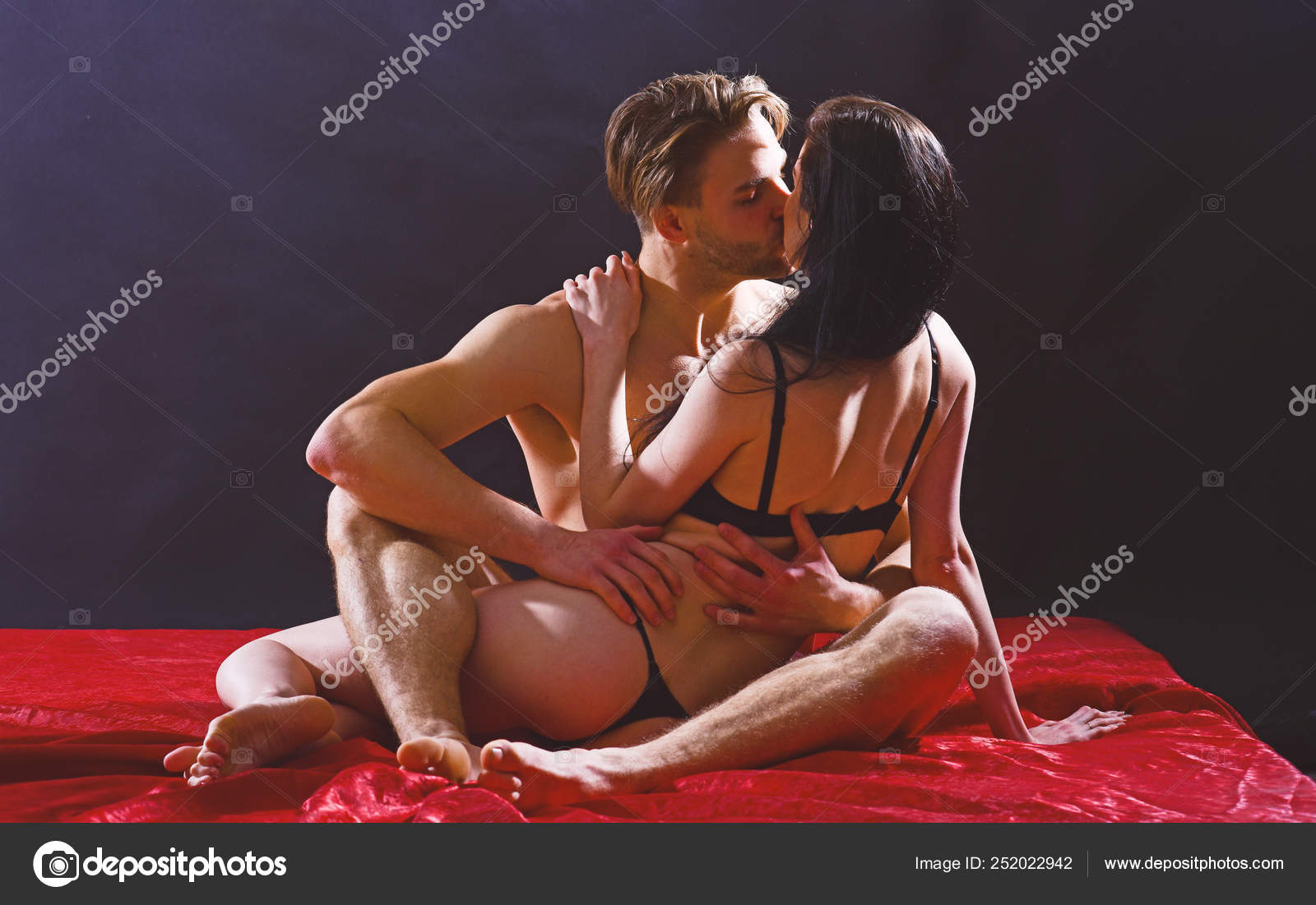 Man hug sexual girlfriend naked buttocks. Sex and love concept. Couple intimate atmosphere. Lover and sexy naked female body foreplay in