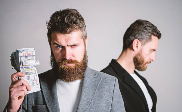 Man bearded fraudster hold cash money while victim stand sad background. While no one watching. How recognize scam and protect yourself. Dishonest scheme. Scam and fraud concept. Scam and deception