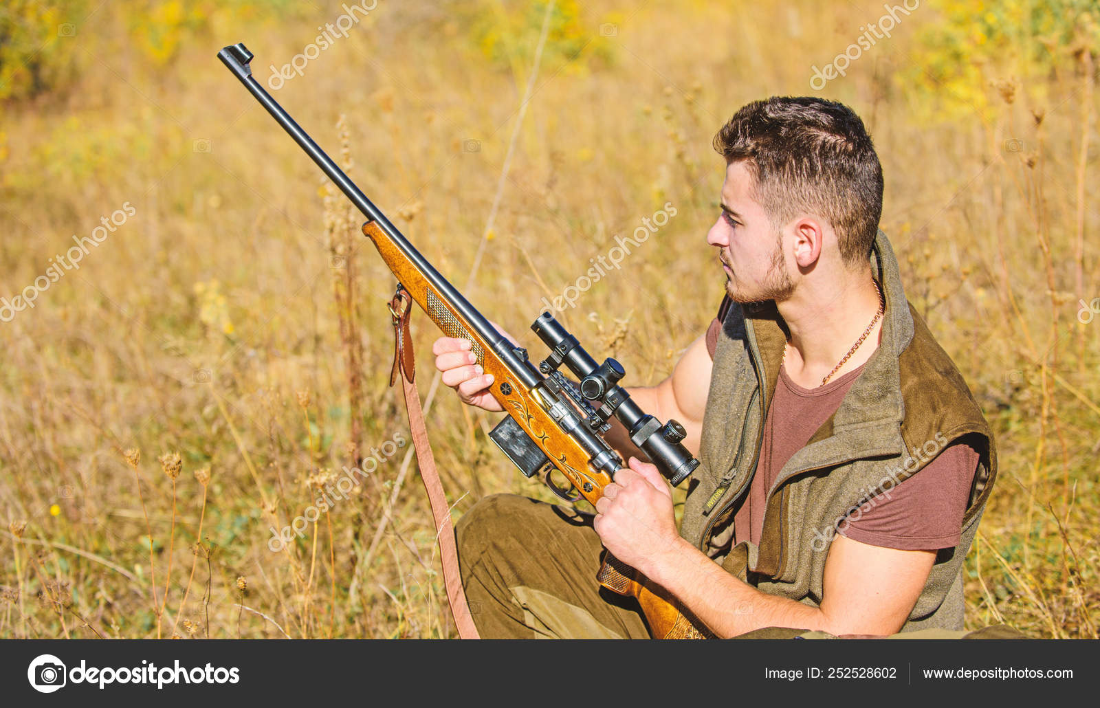 Hunting hobby and leisure. Man charging hunting rifle. Hunting equipment concept. Hunter with rifle looking for animal. Hunter khaki clothes ready to hunt nature background. Hunting shooting trophy Stock Photo by ©stetsik Hunting hobby and leisure. Man charging hunting rifle. Hunting equipment concept. Hunter with rifle looking for animal. Hunter khaki clothes ready to hunt nature background. Hunting shooting trophy Stock Photo by ©stetsik