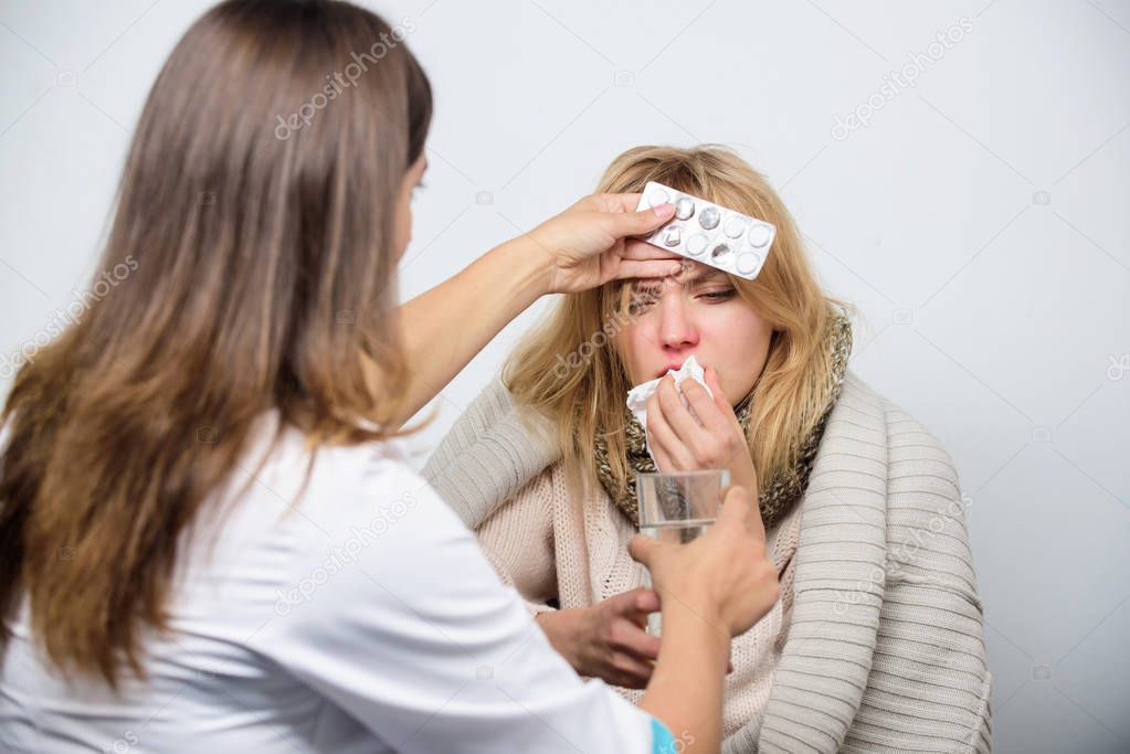 Drug treatment. Primary care doctor making diagnosis to sick woman. Patient care and healthcare. Medical doctor examining patient. Doctor visiting unhealthy woman at home