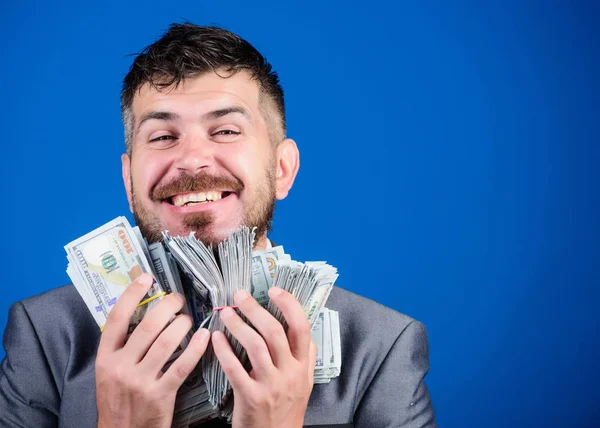 Money and power. winning a lottery. businessman after great deal. Finance and commerce. Business and sport success. happy bearded man has a lot of money. Billioner with dollar banknotes