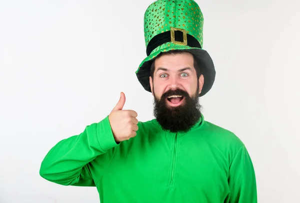 Thumbs up and celebrate. Hipster in leprechaun hat and costume. Bearded man celebrating saint patricks day. Irish man with beard wearing green. Happy saint patricks day Royalty Free Stock Images