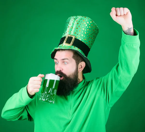 Bar seasonal holiday menu. Green beer mug. Cheers. Alcohol beverage. Lets start patricks party. Irish tradition. Man brutal bearded hipster drink pint beer. Irish pub. Drinking beer part celebration