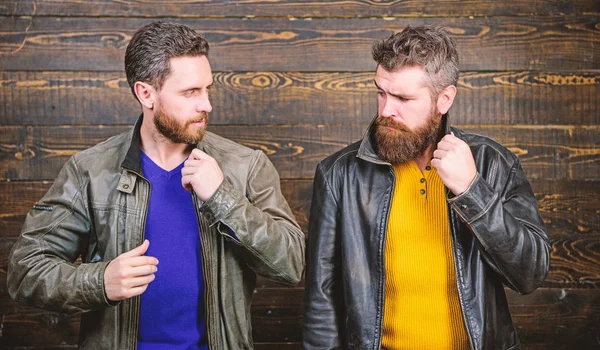 Leather fashion menswear. Men brutal bearded hipster posing in fashionable black leather jackets. Handsome stylish and cool. Feel confident in brutal leather clothes. Brutal men wear leather jackets