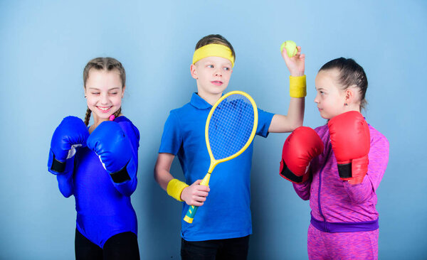 Friends ready for sport training. Sporty siblings. Child might excel completely different sport. Girls kids with boxing sport equipment and boy tennis player. Ways to help kids find sport they enjoy