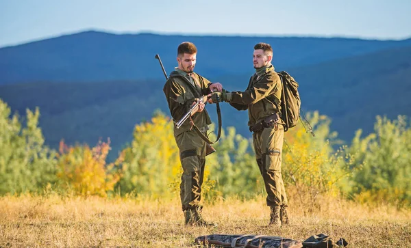 Men bearded hunters with rifle nature background. Experience and practice lends success hunting. How turn hunting into hobby. Guys hunting nature environment. Masculine hobby activity. Hunting season — Stock Photo, Image